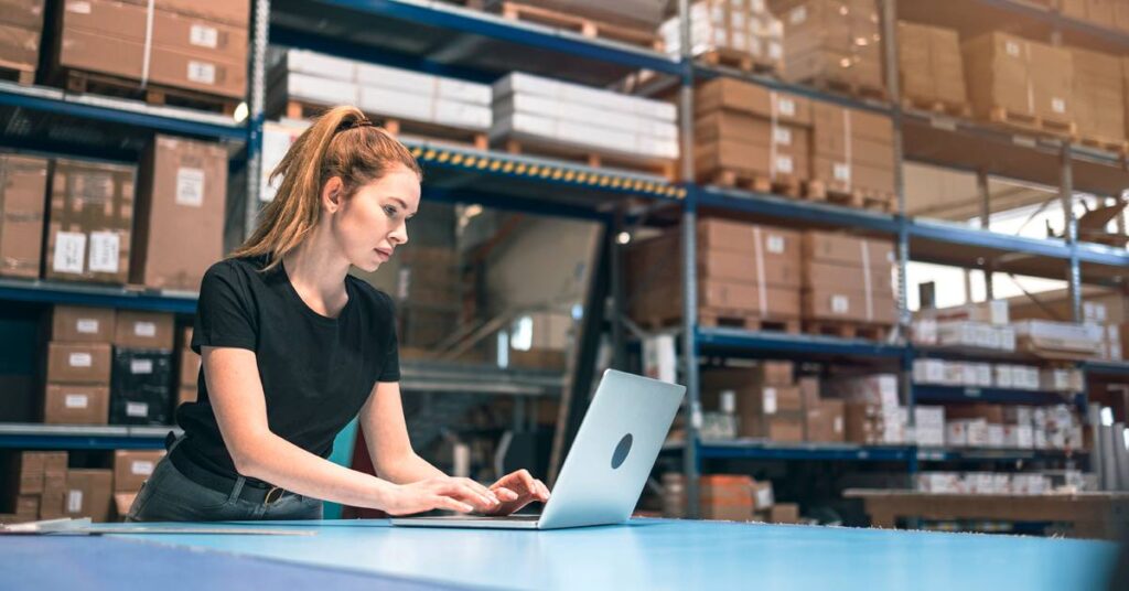 Warehouse person working on a computer