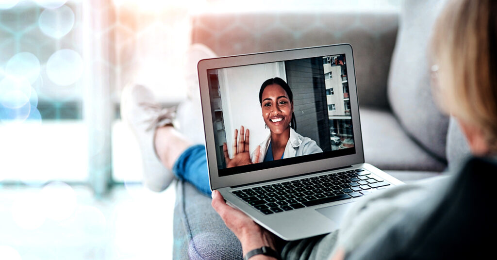 woman talking to her doctor on laptop